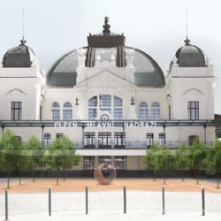 Krémová a šedá, restaurace na peroně. Rekonstrukce hlavního nádraží je ve třetině